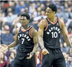  ?? ERNEST DOROSZUK/ POSTMEDIA NETWORK ?? Toronto Raptors’ guards Kyle Lowry, left, and DeMar DeRozan react to a call during first half action against the Milwaukee Bucks, at the Air Canada Centre, on Friday.