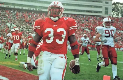 ?? RICK WOOD / MILWAUKEE JOURNAL SENTINEL ?? Ron Dayne remains the program's all-time rushing leader with 7,125 yards and won the Heisman Trophy in 1999. He averaged 1,781 yards per season at Wisconsin.