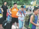  ?? PROVIDED TO CHINA DAILY ?? Elementary and middle school students get ready for a 10-day training camp to lose weight in Jinan, Shandong province. About 500 participat­ed.