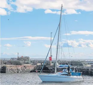  ??  ?? The yacht is back in Arbroath harbour in the hands of owner Michael Gray, pictured, who discovered it was missing when he logged into a webcam.