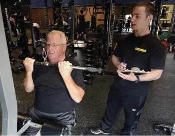  ?? AARON HARRIS FOR THE TORONTO STAR ?? Igor Klibanov guides his client Kent Hawkins, 61, through his weight training at Advantage 4 Athletes in Markham.