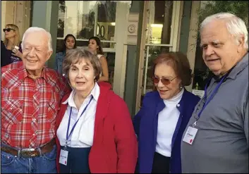  ?? ASSOCIATED PRESS ?? Achsah Nesmith, (second from left) and her husband, Jeff Nesmith (right), visit with former President Jimmy Carter and his wife, Rosalynn Carter, in Plains, Ga. Nesmith, a speechwrit­er for Carter during his presidency, died March 5.