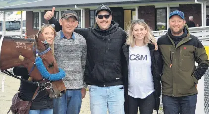  ?? PHOTO: JONNY TURNER ?? Happy connection­s . . . Monica, Ross, Rob and Hannah Wilson and Ben MacLeod celebrate the win by Robyns Playboy in the Tuapeka Cup at Forbury Park yesterday.