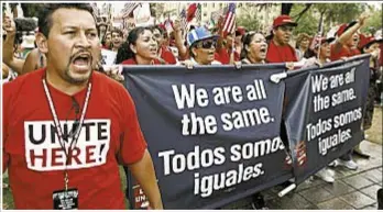  ?? Photo by AP ?? Protesters decried Arizona’s immigratio­n-enforcemen­t laws before Supreme Court ruling.