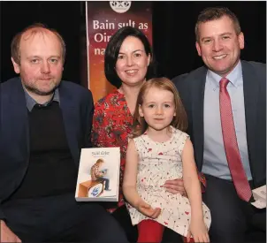  ?? Photo by Michelle Cooper Galvin ?? Dara Ó Cinnéide who did the honours at the launch of Seán Tadhg Ó Gairbhí’s history of TG4 Súil Eile at Oireachtas na Samhna in the Gleneagle on Wednesday - pictured with Seán Tadhg, his wife Emer and daughter Máire.