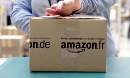  ??  ?? An Amazon package being prepared in a French warehouse. Photograph: Chris Radburn/PA