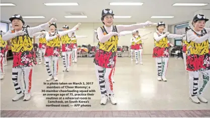  ??  ?? In a photo taken on March 3, 3017 members of ‘Cheer Mommy’, a 30-member cheerleadi­ng squad with an average age of 75, practice their routines at a rehearsal room in Samcheok, on South Korea’s northeast coast. — AFP photos