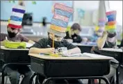  ?? Jason Armond Los Angeles Times ?? SECOND-GRADERS wear masks this month at Weavervill­e Elementary School in Trinity County.