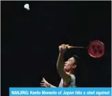  ??  ?? NANJING: Kento Momota of Japan hits a shot against Shi Yuqi of China in the men’s singles final during the badminton World Championsh­ips in Nanjing, Jiangsu province yesterday. —- AFP