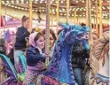  ?? ANDY ABEYTA/THE DESERT SUN ?? 2-year-old Daniella Tapia of Palm Springs rides the merry-go-round with Briana Tapia during the Riverside County Fair & National Date Festival in Indio, Calif., Tuesday, Feb. 21, 2023.