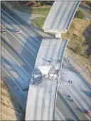  ?? REED SAXON / AP FILE (1994) ?? A collapsed overpass above Interstate 5 near Reseda, Calif., is seen after a 1994 earthquake in the San Fernando Valley. Officials say a major earthquake along the San Andreas fault has the potential of splitting Interstate 15, the major route between...