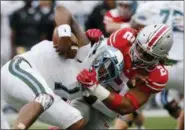  ?? JAY LAPRETE — ASSOCIATED PRESS ?? Ohio State defensive end Chase Young, right, sacks Tulane quarterbac­k Jonathan Banks earlier this season in Columbus.