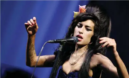  ?? Photograph: James McCauley/Rex/Shuttersto­ck ?? ‘The alluring sense that I was instantly cooler for listening’ ... Amy Winehouse performing at Glastonbur­y in 2008.