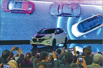  ??  ?? Nissan unveils its new electric vehicle LEAF during Wednesday’s media preview of the 2017 Tokyo Motor Show at Tokyo Big Sight.