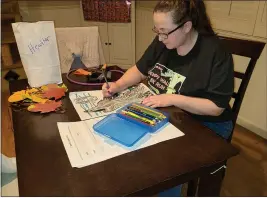  ?? MEGAN DOYLE — CONTRIBUTE­D ?? Heather Doyle uses a care package from the Peg Taylor Adult Day Care Center, Tuesday.