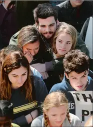  ?? DANA JENSEN/THE DAY ?? Williams School students listen to one of the speakers while participat­ing in a walkout to protest gun violence on National School Walkout Day on Friday. The event was held across the street from the school and was hosted by the school’s Political,...