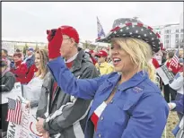  ?? BOB ANDRES / AJC ?? Wendy Harper, from Alpharetta, dressed in patriotic colors and joined scores of backers of Donald Trump at the Georgia Capitol in Atlanta Monday for a “Spirit of America” rally to show their support for his agenda.