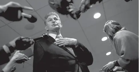  ?? STEFANI REYNOLDS/THE NEW YORK TIMES ?? Sen. Joe Manchin speaks to reporters Dec. 13 at the Hart Senate Office Building in Washington.