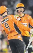  ??  ?? SCORCHING: Sam Whiteman and Ashton Agar celebrate.