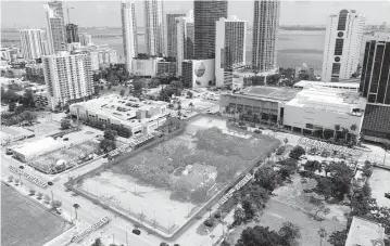  ?? Avison Young ?? Biscayne Place is a three-acre property that includes a Burger King, a parking lot, a two-story commercial building and an empty lot. Bids are already up to $100 million for the site at 1700 Biscayne Boulevard, Avison Young’s John Crotty says.