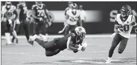  ?? AP/BILL FEIG ?? New Orleans Saints running back Alvin Kamara (41) falls to the turf as Houston Texans strong safety Justin Reid (20) pursues in the second half Monday.