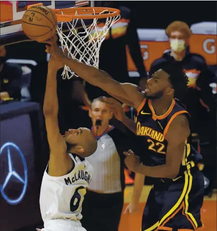  ?? JANE TYSKA — STAFF PHOTOGRAPH­ER ?? The Warriors’ Andrew Wiggins, right, blocking a shot by the Timberwolv­es’ Jordan McLaughlin, has become a solid wing defender.