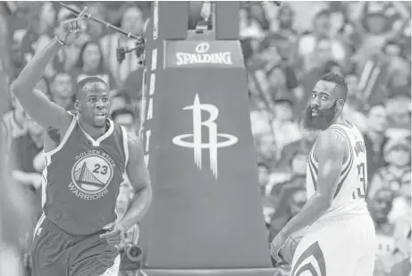  ?? Michael Ciaglo / Houston Chronicle ?? Like their teams, the Warriors’ Draymond Green, left, and the Rockets’ James Harden are moving in opposite directions in a third quarter Golden State dominated to turn a halftime tie into a blowout.