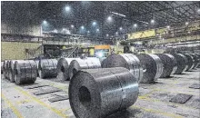  ?? TARA WALTON
THE CANADIAN PRESS FILE PHOTO ?? Rolls of coiled steel produced at Dofasco in Hamilton. Canada needs to stand its ground in its ongoing tariff fight with the U.S., MPs were told.