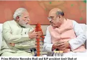  ??  ?? Prime Minister Narendra Modi and BJP president Amit Shah at the party headquarte­rs to celebrate victory in UP and Uttrakhand Assembly elections, in New Delhi on Sunday