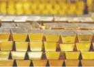  ?? Mike Groll, The Associated Press ?? Gold bars are stacked in a vault at the United States Mint, in West Point, N.Y. Many investors are buying gold because they’re worried that the good times are about to end for those other investment­s, such as stocks and bonds.