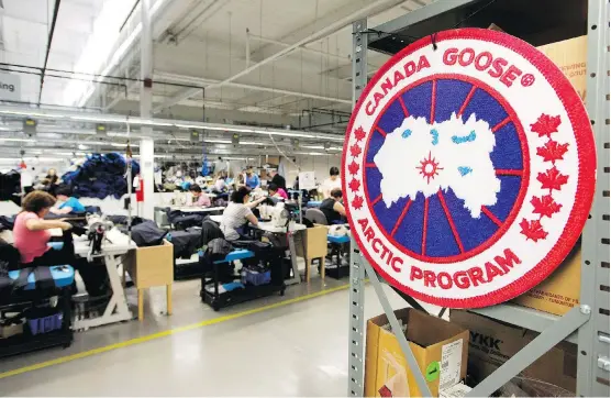  ?? NATHAN DENETTE/THE CANADIAN PRESS FILES ?? Employees work on Canada Goose jackets at the company’s factory in Toronto. Canada Goose CEO Dani Reiss has spent considerab­le time and money trying to stop the flow of counterfei­ted goods, but Reiss has a love-hate relationsh­ip with fake products because he admits they can have benefits.