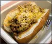  ?? Arkansas Democrat-Gazette/ERIC E. HARRISON ?? Lucky Lou’s menu consists principall­y of hot dogs, including the Premium Dog with chili and cheese.
