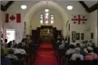  ?? ?? Members of several local churches gather within St. Ambrose Anglican Church for theRegiona­l Early Harvest Service.