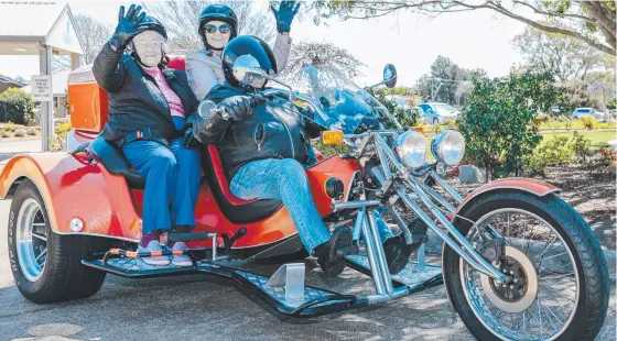  ??  ?? FLY LIKE THE WIND: Yukana resident 100-year-old Beryl Muller and daughter-in-law Helen Muller with Terry Gilchrist of Darling Downs Trike Tours.