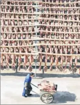  ?? QIAN XUDONG / FOR CHINA DAILY ?? Jinhua ham is dried in the sun in Zhejiang province. Selling on Tmall has helped boost annual sales growth of China’s classic brands such as Jinhua Ham.