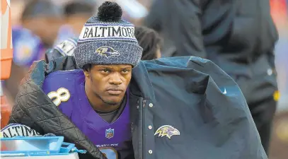  ?? LLOYD FOX/TNS ?? Baltimore Ravens quarterbac­k Lamar Jackson (8) sits on the bench at the end of the half against the Los Angeles Chargers on Jan. 6 at M&T Bank Stadium in Baltimore.