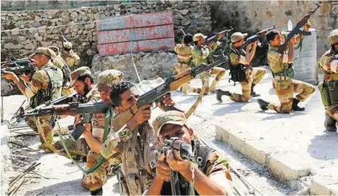  ?? Reuters ?? Showdown Soldiers loyal to Yemen’s government engaged in a training exercise in the southweste­rn city of Taiz on Sunday. An estimated 80 per cent of the population requires humanitari­an aid.