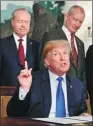  ?? EVAN VUCCI / AP ?? US President Donald Trump speaks in the White House on Thursday before signing memorandum on tariffs.