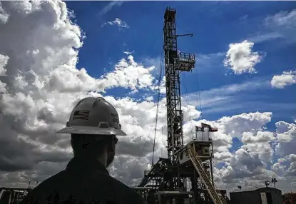  ?? Staff file photo ?? An oil rig drills outside of Midland. The oil-field services sector has been among the industry’s hardest hit during the pandemic.