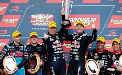  ??  ?? Winners are grinners -- the Bathurst podium with (from left) Steve Owen and Mark Winterbott­om, Steven Richards and Craig Lowndes, and Garth Tander and Warren Luff. Photo credit Daniel Kalisz.