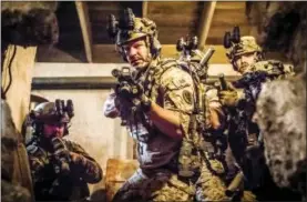  ??  ?? This image released by CBS shows David Boreanaz as Jason Hayes, center, in a scene from the military drama “SEAL Team,” that follows the profession­al and personal lives of the most elite unit of Navy SEALs.