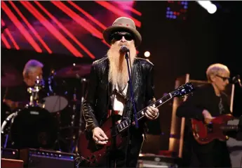  ?? JAMIE MCCARTHY — GETTY IMAGES ?? Billy Gibbons, center, will lead ZZ Top into the Los Angles County Fair on Saturday as the Texas outfit shows no signs of slowing after 50-plus years on the road and in the studio.