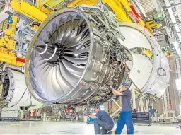  ??  ?? Work being carried out on one of Rolls-Royce’s Trent XWB engines.