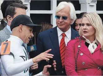  ?? ASSOCIATED PRESS FILE PHOTO ?? Mike Smith speaks to Bob Baffert and Jill Baffert after Justify, with Smith atop, won the 143rd Preakness Stakes horse race at Pimlico race course May 19 in Baltimore.