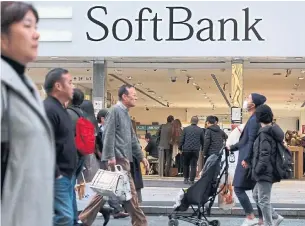  ?? KAZUHIRO NOGI AGENCE FRANCE-PRESSE ?? SoftBank Corp. CEO Ken Miyauchi said the company would improve its network and pursue new revenue through partnershi­ps with companies in which parent SoftBank Group has invested.