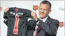  ??  ?? Bryan Harsin, Texas’ co-offensive coordinato­r for two seasons, stepped in Wednesday as head coach at Arkansas State. Harsin, 35, replaces Auburn-bound Gus Malzahn.