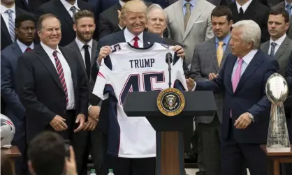  ??  ?? Bill Belichick (left) stands alongside Donald Trump following the Patriots’ Super Bowl victory in 2017. Photograph: Saul Loeb/AFP/Getty Images