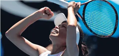  ?? AP ?? Taiwan’s Hsieh Su-wei celebrates after defeating Spain’s Garbine Muguruza in their second round match at the Australian Open tennis championsh­ips in Melbourne, Australia, yesterday.