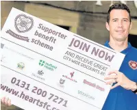  ??  ?? No.1 FAN McLaughlin promotes supporters benefit scheme