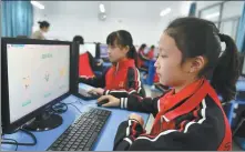  ?? WANG HUIFU / FOR CHINA DAILY ?? Students pay respect to the deceased through a website at their school in Zigui, Hubei province, in April last year.